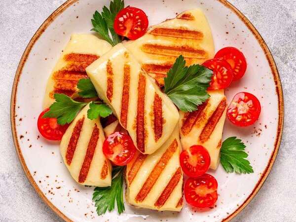 Greek Cheese Guide: 12 Traditional Varieties 3 Golden grilled halloumi cheese slices served as a Mediterranean appetizer
