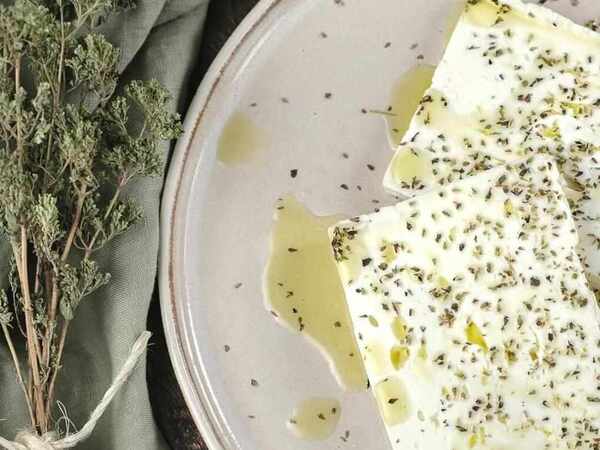 Greek Cheese Guide: 12 Traditional Varieties 2 Traditional Greek feta cheese served with olives and Mediterranean ingredients