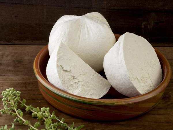 Greek Cheese Guide: 12 Traditional Varieties 8 Fresh traditional Greek mizithra cheese in a rustic serving bowl